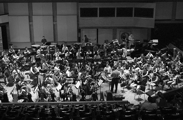 black and white photo of orchestra rehearsing